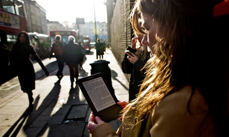 A woman reading on a Kindle