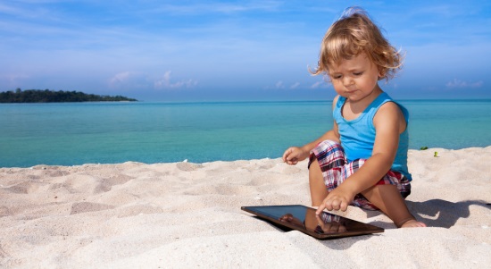 child-tablet-beach