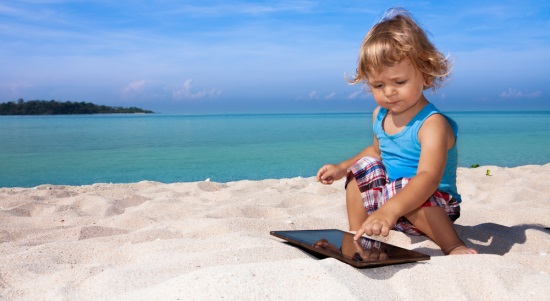 child tablet beach